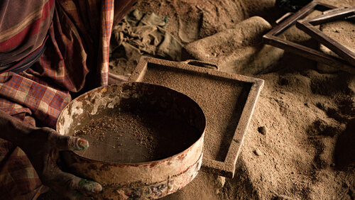 hands making tiles